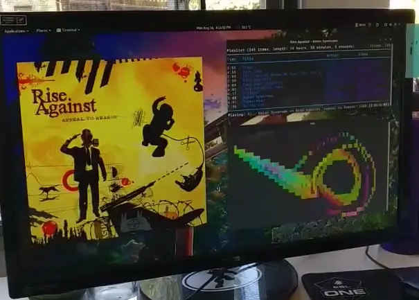 Screenshot of desktop showing covert art art and music visualizer.